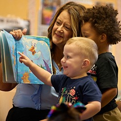 Teacher reading to toddlers