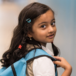 little girl with backpack