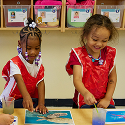 Two girls doing a classroom activity