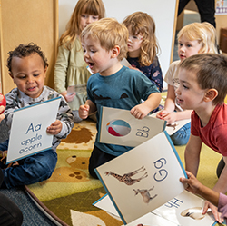 Toddlers engaged in classroom activity during floor time