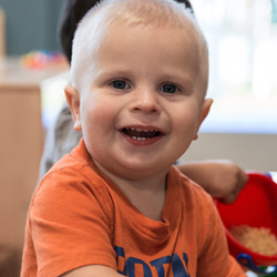 toddler boy smiling at camera
