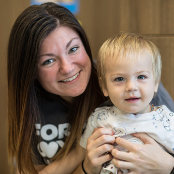 teacher and baby smiling