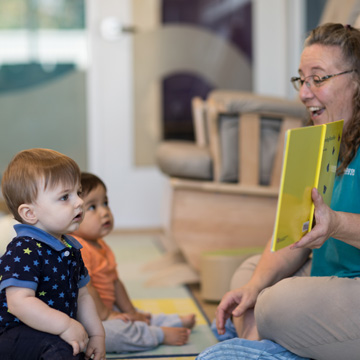 teacher reading to toddlers