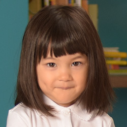 little girl smiling at daycare